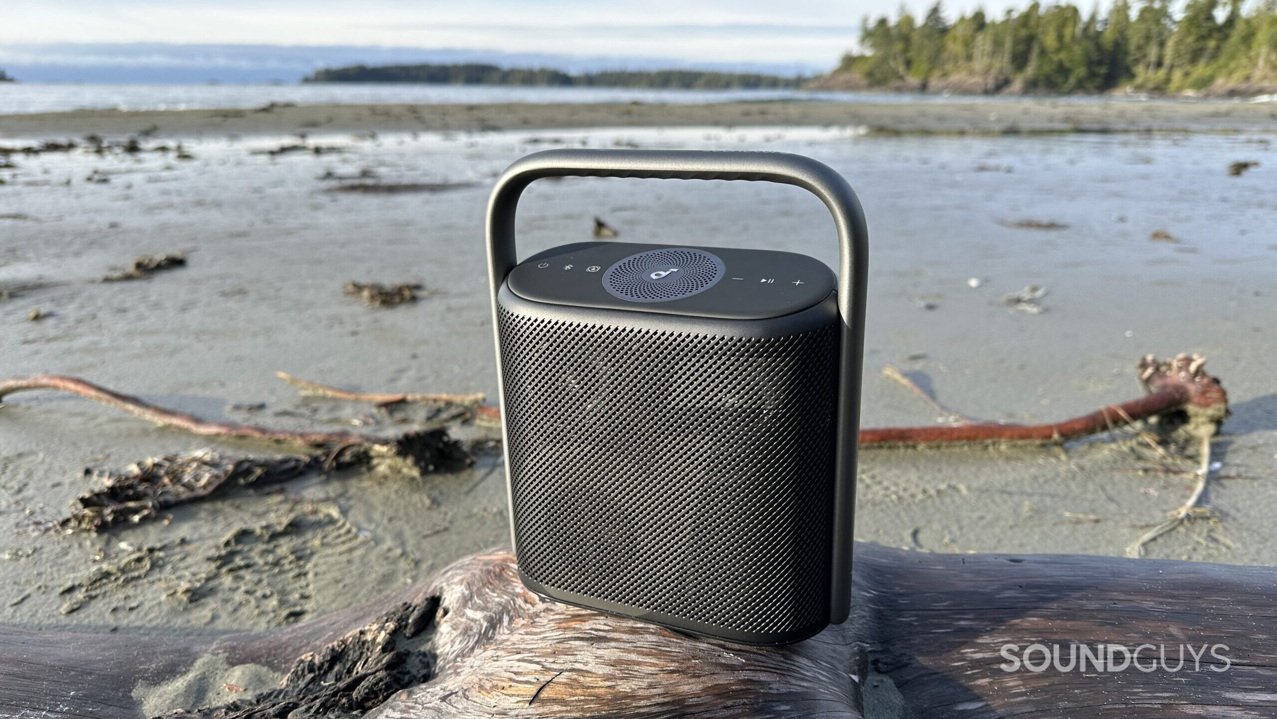 Anker Soundcore Motion X500 4 A Soundcore X500 placed on a log at the beach.