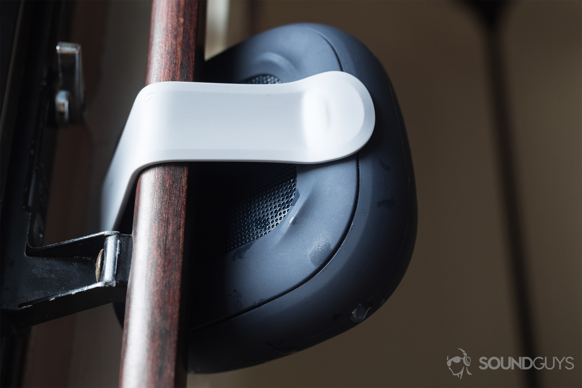 Bose_SoundLink Micro_ (2) The Bose SoundLink Micro (blue) hooked around a sliding door handle. It's a rear, up-facing photo.