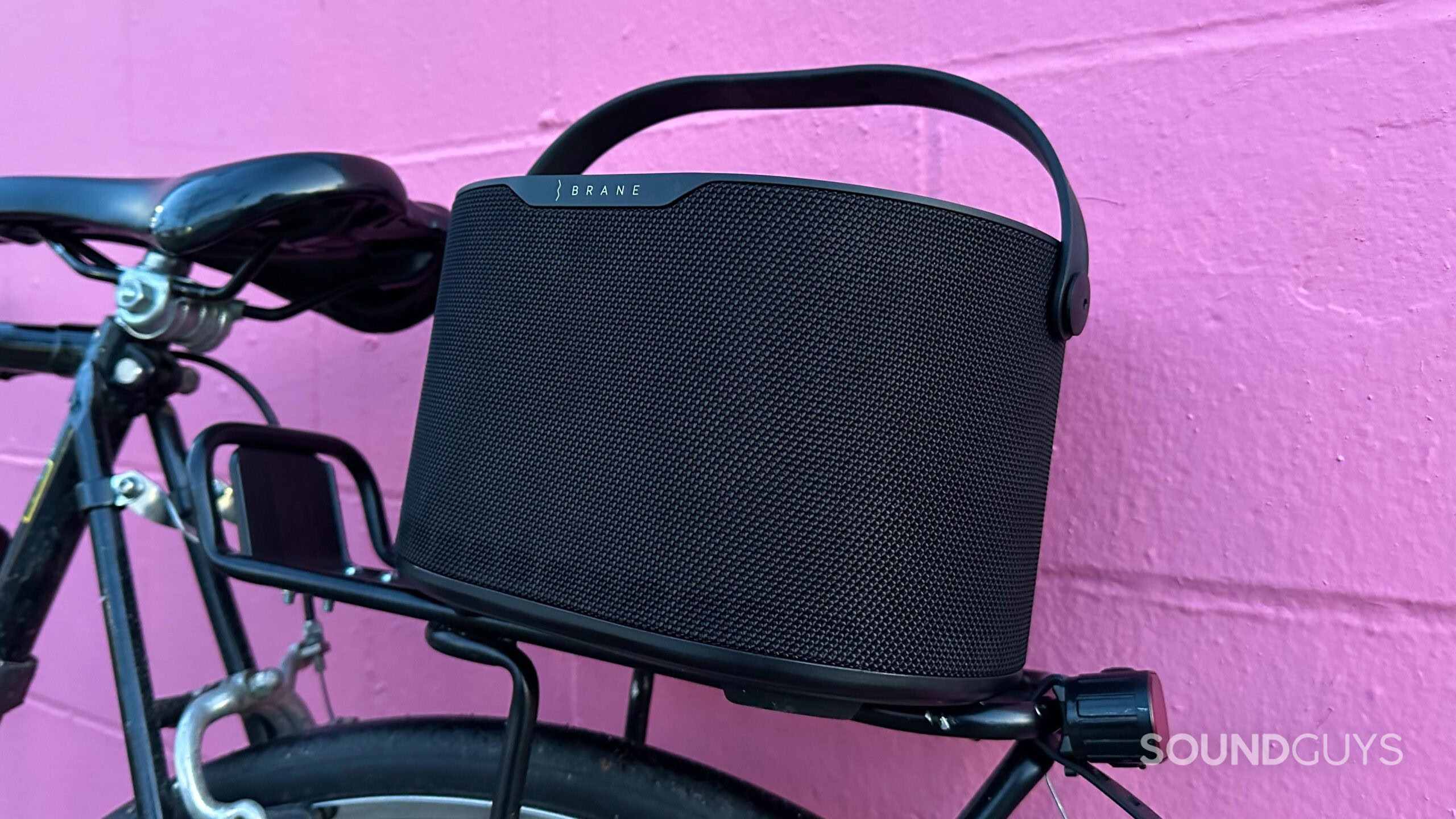 Brane X_10 The Brane X speaker resting on a bike pannier rack above the rear tire.