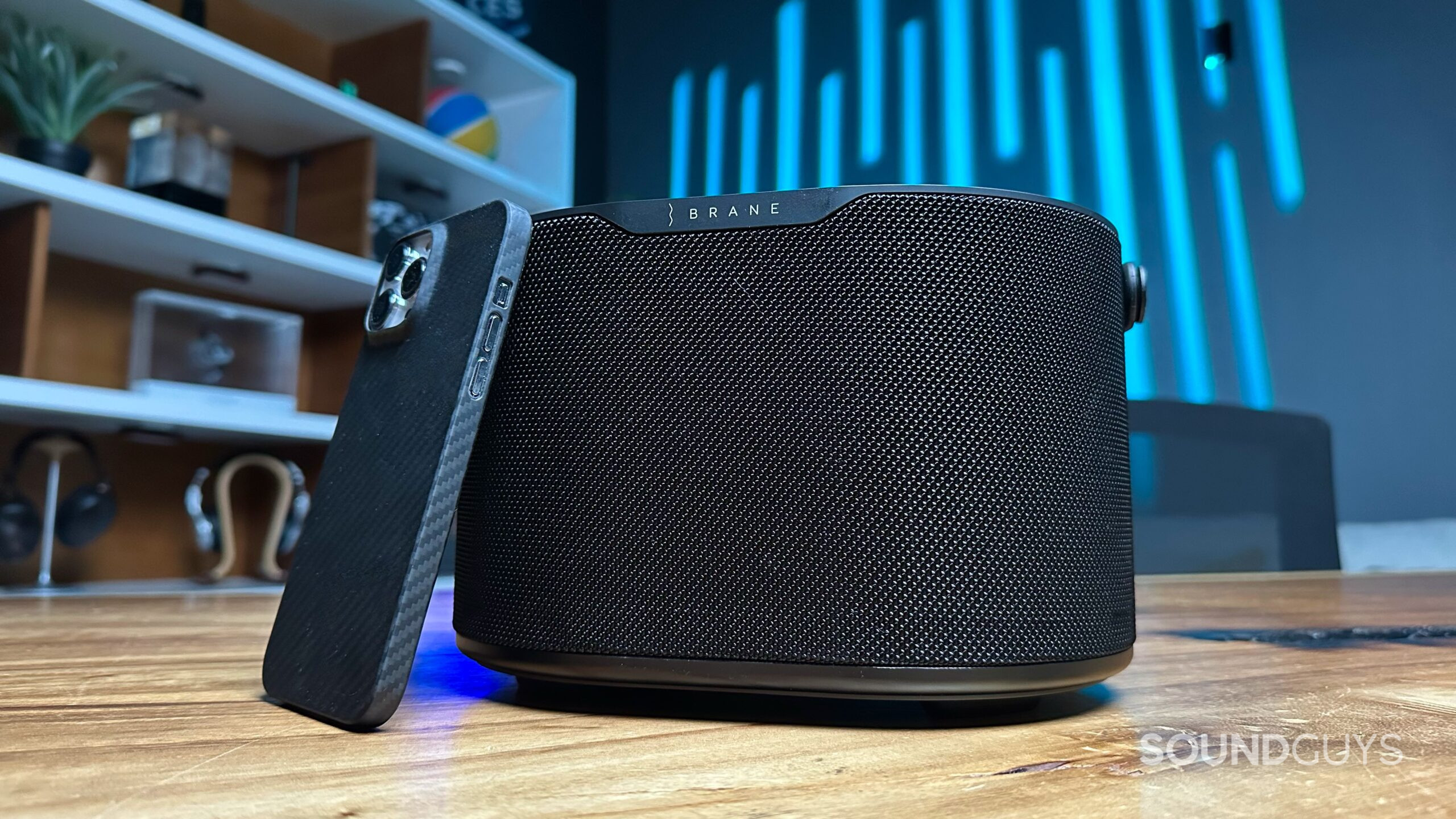 Brane X_8 Photo of a Brane X speaker with an iPhone 14 Pro Max leaning against it for size reference.