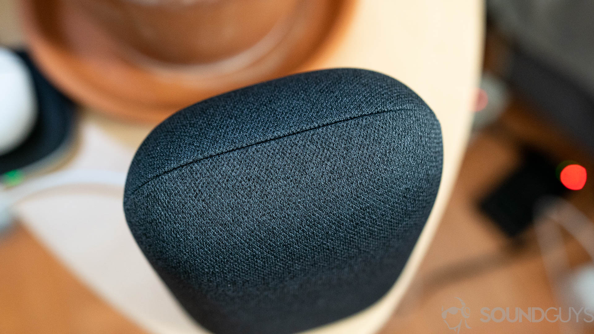 Google Nest Audio fabric stitching Pictured is the gray Google Nest Audio fabric stitching on a bedside table