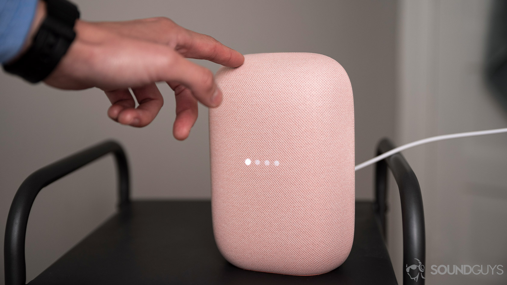 Google Nest Audio-smart speaker touch control A picture the Google Nest Audio touch controls used to lower the volume.